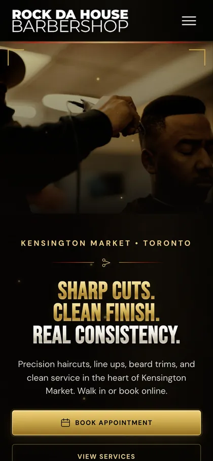 The Rock Da House Barbershop homepage on a phone.